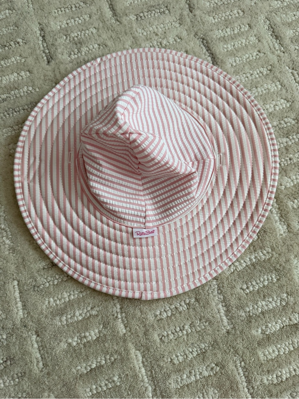 Rufflebutts Swim Hat 0-12 months 
Pink Seersucker